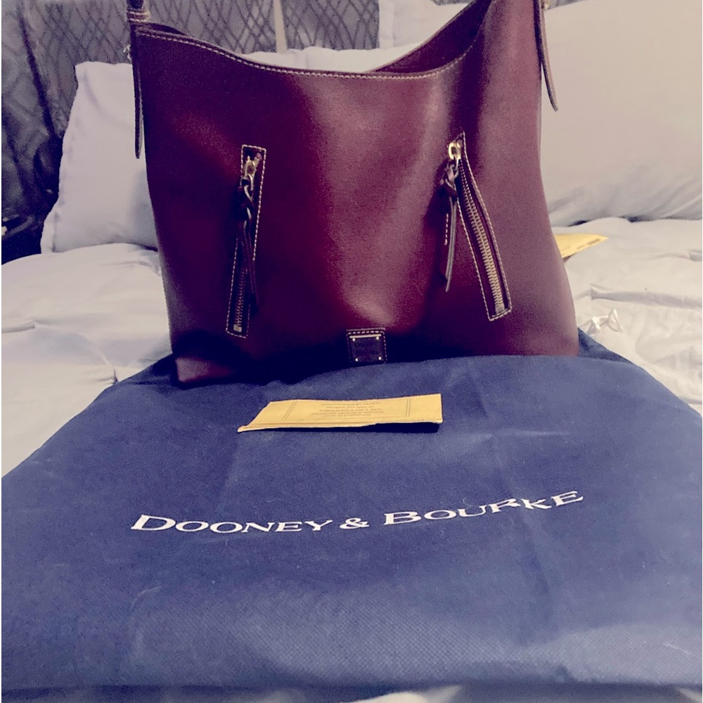 Dooney and Bourke saffiano leather Cooper.. Cranberry is the color.♥️